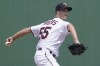 Minnesota Twins pitcher Taylor Rogers (55) delivers a pitch in the third inning of a spring training baseball game against the Tampa Bay Rays at Hammond Stadium, Sunday, March 20, 2022, in Fort Myers, Fla. (AP Photo/Steve Helber)