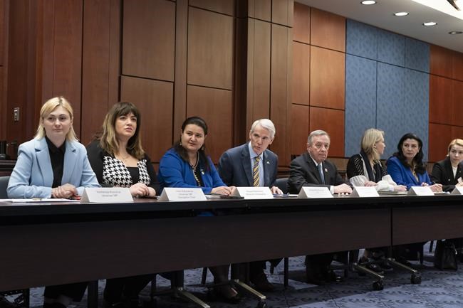 Sen. Rob Portman, R-Ohio, center, and Sen. Dick Durbin, D-Ill., right, hold a meeting with members of the Ukrainian Parliament, at the Capitol in Washington, Wednesday, March 30, 2022. From left are: Ukrainian Parliament members Yevheniya Kravchuk and Lesia Zaburanna, Ukrainian Amb. Oksana Markarova, Sen. Rob Portman, R-Ohio, Sen. Dick Durbin, D-Ill., Ukrainian Parliament members Maria Ionova, Ivanna Klympush-Tsintsadze, and Anastasia Radina. (AP Photo/J. Scott Applewhite)