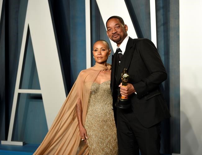 FILE - Jada Pinkett Smith, left, and Will Smith arrive at the Vanity Fair Oscar Party on Sunday, March 27, 2022, at the Wallis Annenberg Center for the Performing Arts in Beverly Hills, Calif. The stunning physical altercation between actor Will Smith and comedian Chris Rock at the 94th Academy Awards on Sunday has sparked debate about the appropriate ways for Black men to publicly defend Black women against humiliation and abuse. (Photo by Evan Agostini/Invision/AP, File)