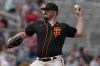 San Francisco Giants starting pitcher Carlos Rodon throws against the San Diego Padres during the first inning of a spring training baseball game, Tuesday, March 29, 2022, in Scottsdale, Ariz. (AP Photo/Matt York)