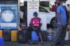 A Sri Lankan man waits to purchase diesel at a fuel pump in Colombo, Sri Lanka, Wednesday, March 30, 2022. (AP Photo/Eranga Jayawardena)