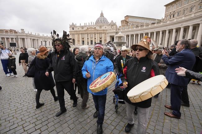 Members of the Assembly of First Nations walk in St. Peter's Square at the end of their meeting with Pope Francis at the Vatican, Thursday, March 31, 2022. (AP Photo/Andrew Medichini)
