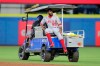 Los Angeles Angels' Dexter Fowler is carted off after a play at second base against the Toronto Blue Jays during the second inning of a baseball game Friday, April 9, 2021, in Dunedin, Fla. Dexter Fowler has signed a minor-league deal with the Toronto Blue Jays, with an invitation to major league spring training. (AP Photo/Mike Carlson)