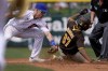 C.J. Abrams (87) is caught stealing by Chicago Cubs' Sergio Alcantara during the third inning of a spring training baseball game, Saturday, March 19, 2022, in Mesa, Ariz. (AP Photo/Matt York)