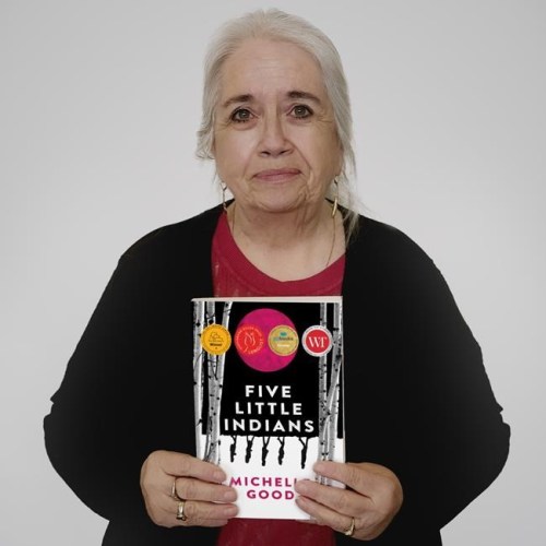 Cree writer and lawyer Michelle Good holds a copy of her book, 