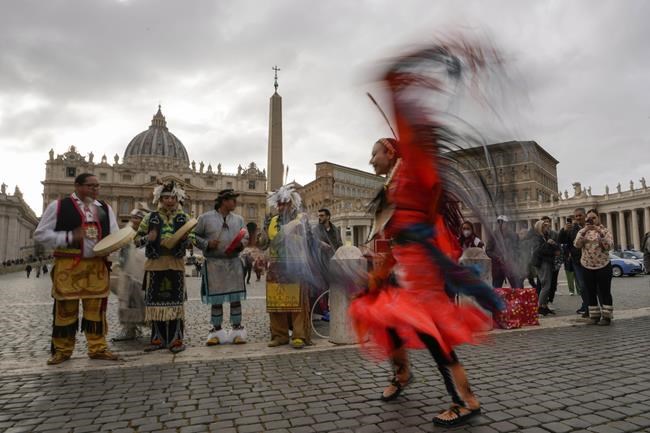 Members of the Assembly of First Nations perform in St. Peter's Square at the Vatican, Thursday, March 31, 2022. Pope Francis has welcomed First Nations delegations to the Vatican. They are seeking an apology for the Catholic Church's role in running Canada's notorious residential schools for Indigenous children. (AP Photo/Alessandra Tarantino)