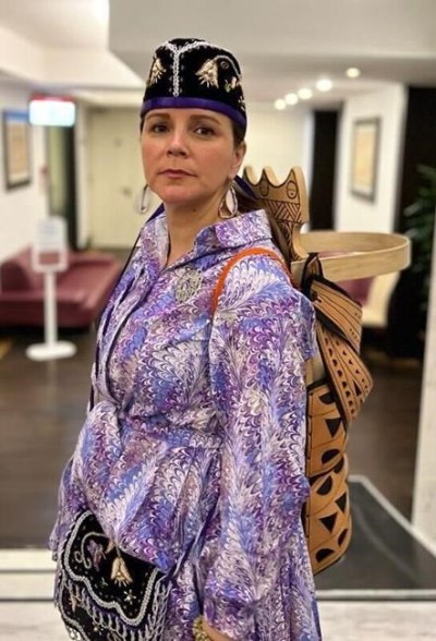 Michelle Schenandoah, in a handout photo, wears an intricate cradle board in Rome that she presented to Pope Francis to represent the First Nation delegates taking their children home. Schenandoah said the Pope will not be able to keep the board and it was to be retrieved from the Vatican on Friday. THE CANADIAN PRESS/HO-Katsisionni Fox  **MANDATORY CREDIT**
