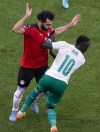 Egypt's Mohamed Salah, left, is challenged by Senegal's Sadio Mane during the World Cup 2022 - Africa playoff soccer match between Senegal and Egypt at at Stade Me Abdoulaye Wade stadium in Dakar, Senegal, Tuesday, March 29, 2022. (AP Photo/Stefan Kleinowitz)