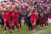 Members of Canada's national soccer team celebrate after clinching a berth in CONCACAF World Cup Qualifier soccer action against Jamaica in Toronto on Sunday March 27, 2022 THE CANADIAN PRESS/Frank Gunn