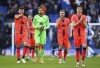 Norwich City players applaud the fans after the final whistle in the English Premier League soccer match between Brighton & Hove Albion and Norwich City, at the AMEX stadium, Brighton, England, Saturday, April 2, 2022. (John Walton/PA via AP)