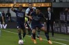 Manchester City's Rodrigo, foreground, tries to keep the ball as Burnley's Josh Brownhill holds him during the Premier League soccer match between Burnley and Manchester City at Turf Moor, in Burnley, England, Saturday, April 2, 2022. (AP Photo/Rui Vieira)