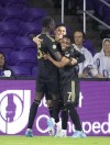 Los Angeles FC players celebrate a goal against Orlando City during an MLS soccer match in Orlando, Fla., Saturday, April 2, 2022. (Willie J. Allen Jr./Orlando Sentinel via AP)