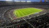 Spectators crowd the Camp Nou stadium during the Women's Champions League quarter final, second leg soccer match between Barcelona and Real Madrid in Barcelona, Spain, Wednesday, March 30, 2022. A world-record crowd for a women's soccer match of more than 91,000 people watched Barcelona defeat Real Madrid 5-2 in the Champions League at the Camp Nou Stadium. (AP Photo/Maria Angela Angles)