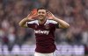 West Ham United's Aaron Cresswell celebrates scoring their side's first goal of the game during the English Premier League soccer match between West Ham United and Everton at the London Stadium, London, Sunday, April 3, 2022. (Mike Egerton/PA via AP)