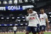 Tottenham's Steven Bergwijn, foreground, celebrates with Son Heung-min, after scoring his side's fifth goal during the Premier League soccer match between Tottenham Hotspur and Newcastle at Tottenham Hotspur stadium, in London, England, Sunday, April 3, 2022. (AP Photo/Ian Walton)