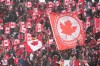 Fans cheer and wave Canadian flags before the start of the Canada-Jamaica CONCACAF World Cup soccer qualifying action in Toronto on Sunday, March 27, 2022. THE CANADIAN PRESS/Nathan Denette