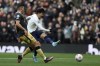 Tottenham's Son Heung-min takes a shot during the Premier League soccer match between Tottenham Hotspur and Newcastle at Tottenham Hotspur stadium, in London, England, Sunday, April 3, 2022. (AP Photo/Ian Walton)