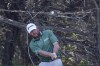 William McGirt hits his second shot on No. 17 during the final round of the Valero Texas Open golf tournament in San Antonio, Sunday, April 3, 2022. (AP Photo/Michael Thomas)