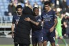 Manchester City's head coach Pep Guardiola, center, hugs Raheem Sterling during the Premier League soccer match between Burnley and Manchester City at Turf Moor, in Burnley, England, Saturday, April 2, 2022. (AP Photo/Rui Vieira)