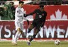 Canada's Alphonso Davies (19) and Mexico's Julio Cesar Domingguez Juarez (3) via for the ball during World Cup Qualifiers in Edmonton, Tuesday, Nov. 16, 2021.&nbsp;Davies has been named CONCACAF 2021 men's player of the year after helping Canada qualify for the World Cup for the first time since 1986. THE CANADIAN PRESS/Jason Franson