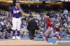 Los Angeles Angels' Brandon Marsh, right, rounds third after hitting a solo home run as Los Angeles Dodgers starting pitcher Julio Urias stands on the mound during the third inning of a spring training baseball game Monday, April 4, 2022, in Los Angeles. (AP Photo/Mark J. Terrill)