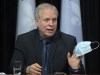 Interim public health director Dr. Luc Boileau holds a mask as he responds to reporters during a news conference on the COVID-19 pandemic, Wednesday, Feb. 16, 2022, at the legislature in Quebec City. THE CANADIAN PRESS/Jacques Boissinot