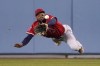 Los Angeles Angels center fielder Jo Adell can't get to a ball hit for a single by Los Angeles Dodgers' Cody Bellinger during the seventh inning of a spring training baseball game Tuesday, April 5, 2022, in Los Angeles. (AP Photo/Mark J. Terrill)