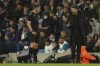 Atletico Madrid's head coach Diego Simeone, right, argues with referee Istvan Kovacs during the Champions League, first leg, quarterfinal soccer match between Manchester City and Atletico Madrid at the Etihad Stadium, in Manchester, Tuesday, April 5, 2022. (AP Photo/Dave Thompson)