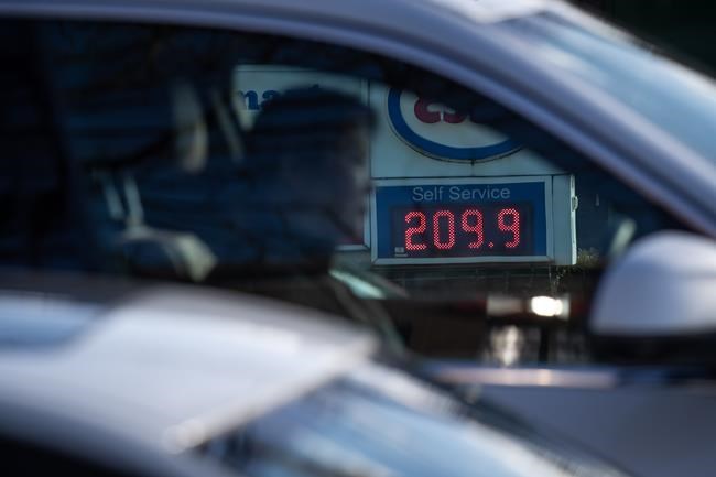 A sign displays the price of a litre of regular grade gasoline at an Esso gas station as a motorist waits at a red light, in Vancouver, on Tuesday, March 8, 2022. Republicans on Capitol Hill are resurrecting the long-dead Keystone XL pipeline expansion in an effort to blame President Joe Biden for soaring gasoline prices. THE CANADIAN PRESS/Darryl Dyck