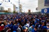 Toronto Blue Jays fans wait in line outside of the Rogers Centre in Toronto on Wednesday, October 14, 2015. Hundreds of new lights as well as a brand new 8,000 sq. ft. videoboard, featuring two new lower wings and side ribbons that wrap around the stadium, have been installed in the stadium in downtown Toronto in time for Friday's home opener against the Texas Rangers. THE CANADIAN PRESS/Marta Iwanek