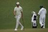 Corey Conners, of Canada, throws balls down on the second green during a practice round for the Masters golf tournament on Wednesday, April 6, 2022, in Augusta, Ga. THE CANADIAN PRESS/AP/David J. Phillip