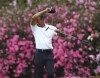 Tiger Woods wipes his face on the 13th green during a practice round for the Masters at Augusta National Golf Club in Augusta, Ga., Wednesday, April 6, 2022. (Curtis Compton/Atlanta Journal-Constitution via AP)