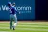 Kansas City Royals second baseman Whit Merrifield makes a catch on a pop fly hit by Milwaukee Brewers' Lorenzo Cain during the first inning of a spring training baseball game Tuesday, April 5, 2022, in Phoenix. (AP Photo/Ross D. Franklin)