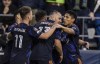 Seattle Sounders FC forward Jordan Morris, second from right, is congratulated by teammates, including midfielder Albert Rusnak (11) and forward Raul Ruidiaz, right, after scoring a goal against New York City FC during the first half of the first leg of a CONCACAF Champions League soccer semifinal Wednesday, April 6, 2022, in Seattle. (AP Photo/Stephen Brashear)