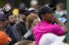 Tiger Woods watches his tee shot on the first hole during the first round at the Masters golf tournament on Thursday, April 7, 2022, in Augusta, Ga. (AP Photo/Charlie Riedel)