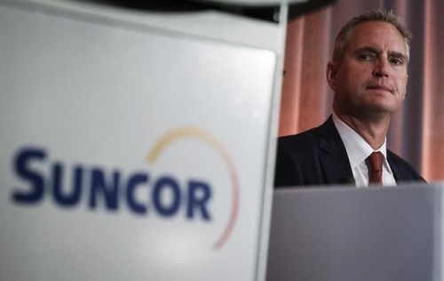 Suncor president and CEO Mark Little prepares to address the company's annual meeting in Calgary on May 2, 2019. Federal Environment Minister Steven Guilbeault is warning Canada's biggest oilsands producer that its planned mine expansion may not meet climate targets. THE CANADIAN PRESS/Jeff McIntosh
