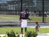 Atlanta Braves outfielder Ronald Acuna gets in some father & son time with Ronald Acuna Jr. II after he finishes up batting practice during Spring Training on Thursday, March 17, 2022, in North Port, Fla. (Curtis Compton/Atlanta Journal-Constitution via AP)