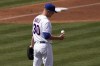 Chicago Cubs starting pitcher Alec Mills flips the ball after giving up a run during the second inning of a spring training baseball game against the Colorado Rockies, Friday, March 25, 2022, in Mesa, Ariz. (AP Photo/Matt York)