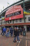 Ukrainian flags are seen outside Wrigley Field as fans arrive for the Chicago Cubs home-opener baseball game against the Milwaukee Brewers, Thursday, April 7, 2022, in Chicago. (AP Photo/Kamil Krzaczynski)