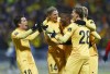 Bodo Glimt's Hugo Vetlesen, Ulrik Saltnes, Brice Wembangomo Runar Espejord and Elias Kristoffersen Hagen celebrate a goal during the Europa Conference League quarterfinal soccer match between Bodo Glimt and AS Roma at Aspmyra stadium, Bodo, Norway, Thursday April 7, 2022. (Mats Torbergsen/NTB via AP)