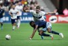 Sporting Kansas City's Nicolas Isimat-Mirin, front, and Vancouver Whitecaps Brian White vie for the ball during the first half of an MLS soccer game in Vancouver on Saturday, April 2, 2022.&nbsp;Just five games into the Major League Soccer season, Vanni Sartini says his side Vancouver Whitecaps are preparing for another crucial match. THE CANADIAN PRESS/Darryl Dyck