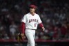 Los Angeles Angels starting pitcher Shohei Ohtani walks off the mound as he is replaced during the fifth inning of the team's baseball game against the Houston Astros on Thursday, April 7, 2022, in Anaheim, Calif. (AP Photo/Ashley Landis)