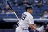 New York Yankees' Josh Donaldson hits the walk-off single in the twelfth inning of an opening day baseball game against the Boston Red Sox, Friday, April 8, 2022, in New York. (AP Photo/John Minchillo)