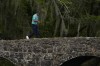 Tiger Woods walks across the Nelson Bridge during the second round at the Masters golf tournament on Friday, April 8, 2022, in Augusta, Ga. (AP Photo/Matt Slocum)