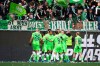 Wolfsburg's Lukas Nmecha (center) celebrates after scoring the 2:0 goal during the Bundesliga soccer match between VfL Wolfsburg and Arminia Bielefeld in Wolfsburg, Germany, Saturday, April 9, 2022. (Swen Pfoertner/dpa via AP)
