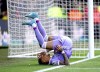 Leeds United's Raphinha rolls backwards as he celebrates scoring their side's first goal of the game, during the English Premier League soccer match between Watford and Leeds United at Vicarage Road, in Watford, England, Saturday April 9, 2022. (John Walton/PA via AP)