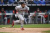 Cleveland Guardians' Myles Straw runs out a grounder for a single against the Kansas City Royals during the fourth inning of a baseball game, Thursday, April 7, 2022 in Kansas City, Mo. (AP Photo/Reed Hoffmann)
