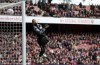 Brighton's goalkeeper Robert Sanchez receiving a goal from Arsenal's Martin Odegaard during the English Premier League soccer match between Arsenal and Brighton and Hove Albion at Emirates stadium in London, Saturday, April 9, 2022. (AP Photo/Ian Walton)