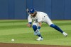 Toronto Blue Jays shortstop Bo Bichette (11) catches a ground ball during the seventh inning of AL MLB baseball action against the Texas Rangers, in Toronto on Saturday, April 9, 2022. THE CANADIAN PRESS/Christopher Katsarov