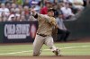 San Diego Padres' Manny Machado fields a base hit by Arizona Diamondbacks Christian Walker during the fourth inning of a baseball game, Saturday, April 9, 2022, in Phoenix. (AP Photo/Matt York)